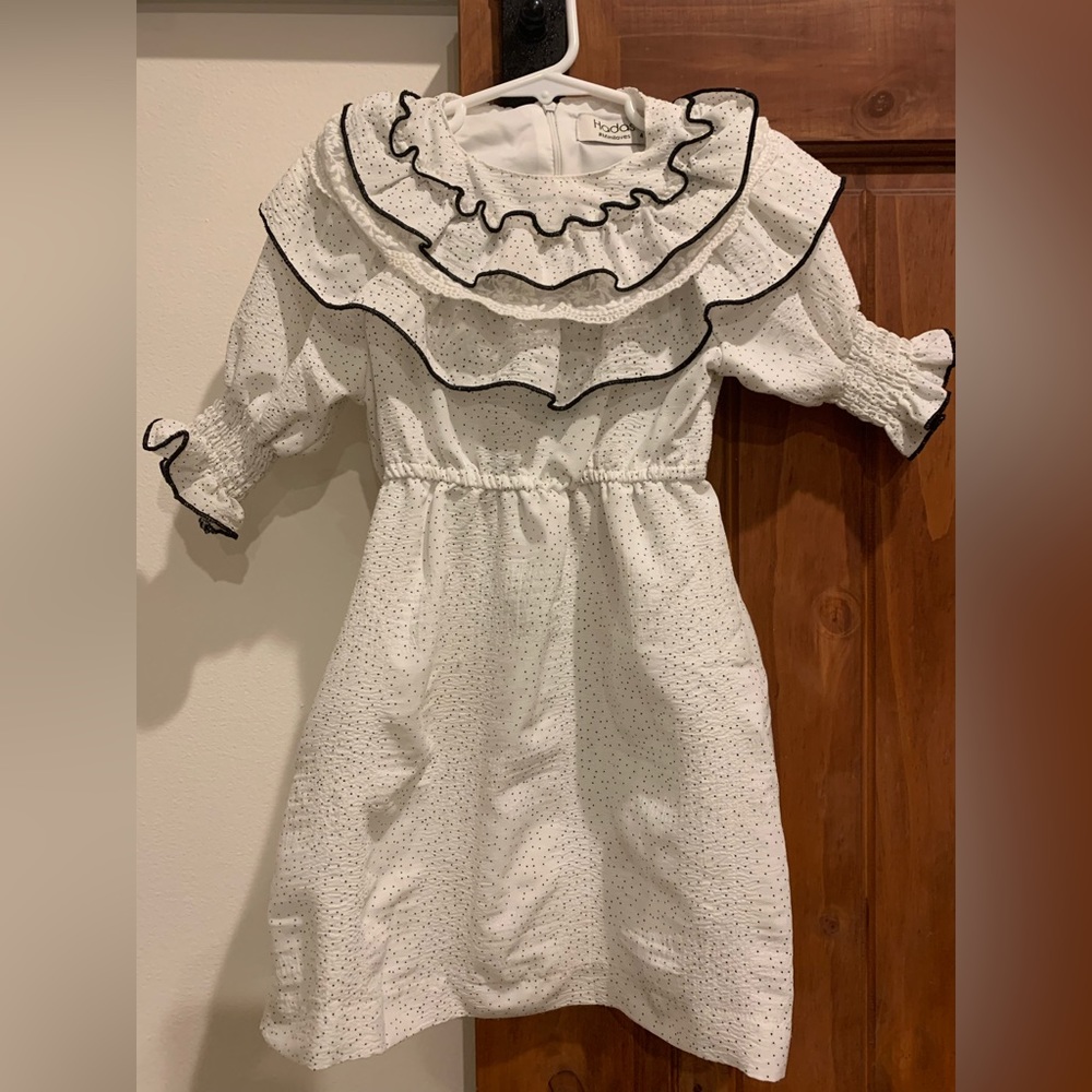 Hadas girls white ruffle dress with 3/4 sleeves. Lace detailing